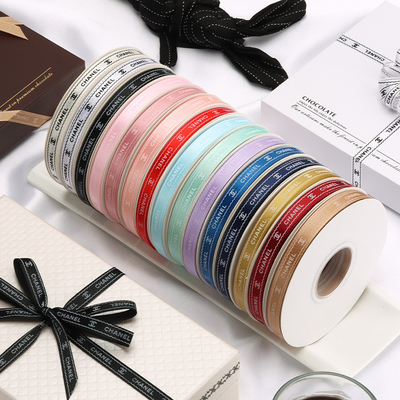 comprare 1 cm Piccolo nastro di poliestere stampato profumato Logo personalizzato Imballaggio di fiori Nastro colore Nastro scatola di torta di compleanno online manufacture
