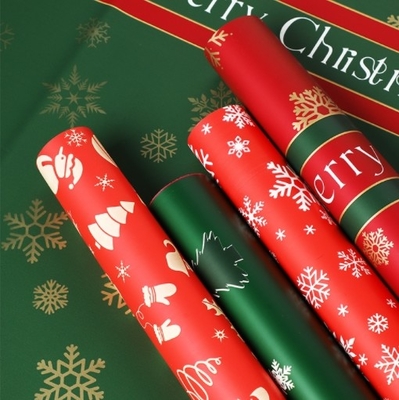 Un buon prezzo. Carta da confezionamento di fiori di Natale, carta da confezionamento di un bouquet di mele per la vigilia di Natale, cellophane impermeabile a fiocchi di neve, regali in carta Ouya in linea