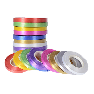 comprare La pianura colora il rotolo del nastro dell'involucro di regalo del poliestere che imballa 2.0cm online manufacture