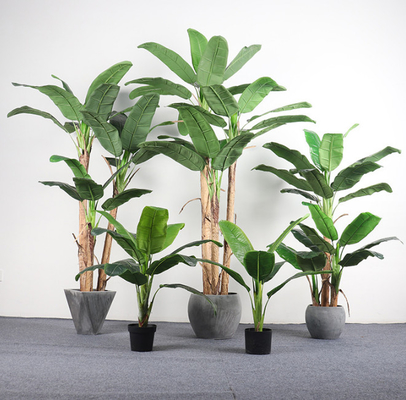 Un buon prezzo. Il sempreverde artificiale delle grandi foglie lascia le piante del pavimento di Japonica in linea