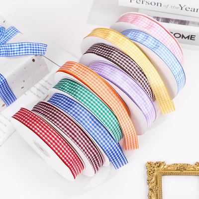 Un buon prezzo. Produttore all'ingrosso 2cm nastro a quadri scozzese, nastro a quadri, nastro britannico, accessori per abbigliamento, materiali fai da te fatti a mano in linea