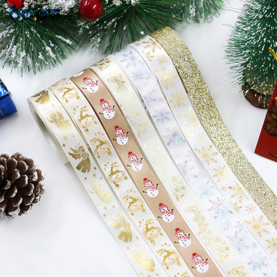Un buon prezzo. nastri dorati di Natale, corone di Natale, alberi di Natale, archi, decorazioni, confezioni regalo fai da te, nastri per feste e nastri in linea