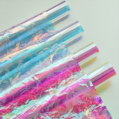 Un buon prezzo. Fiorista di avvolgimento laser trasparente carta di rivestimento interno arcobaleno per pellicola iridescente bouquet imballaggio Tempo di spedizione 30-45 giorni in linea
