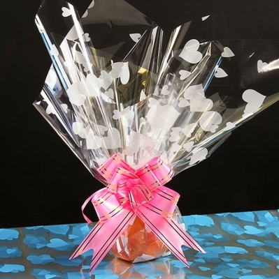 Un buon prezzo. Carta di cellophane stampata a forma di cuore, carta per mele, carta per fiori, frutta e frutta natalizia, articoli da fare da soli per la vigilia di Natale e per Natale in linea