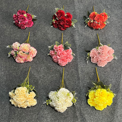 Un buon prezzo. Simulazione di garofano a 7 teste artificiale falso bouquet fiore di plastica artificiale decorazione del soggiorno di alta gamma arredamento floreale di matrimonio in linea